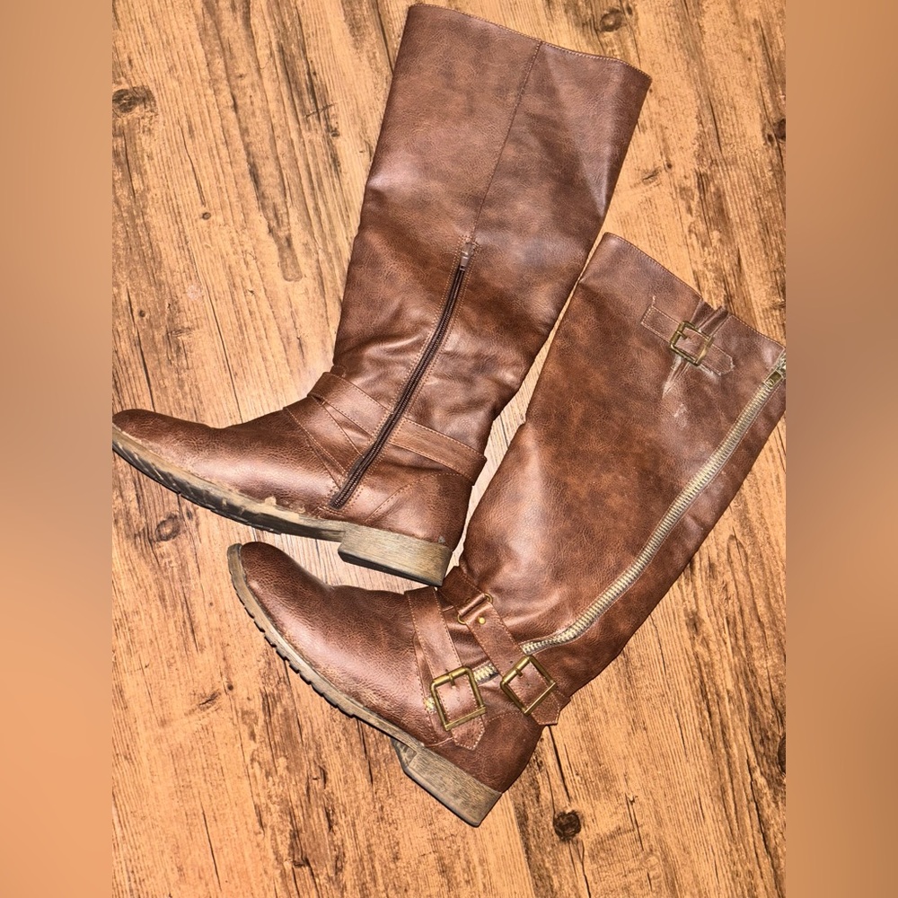 Worn Knee High Leather boots